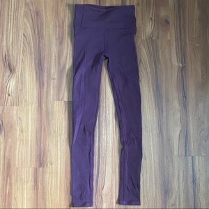 Maroon Lululemon leggings with floral cutouts